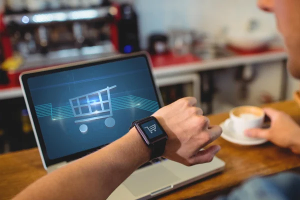 man using laptop to do online shopping